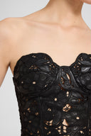 Strapless lambskin leather bustier top with hand-cut floral motif
