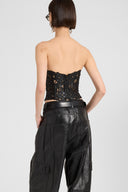 Strapless lambskin leather bustier top with hand-cut floral motif