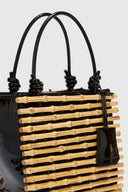 Mini Maggie in patent leather with hand-woven bamboo handles