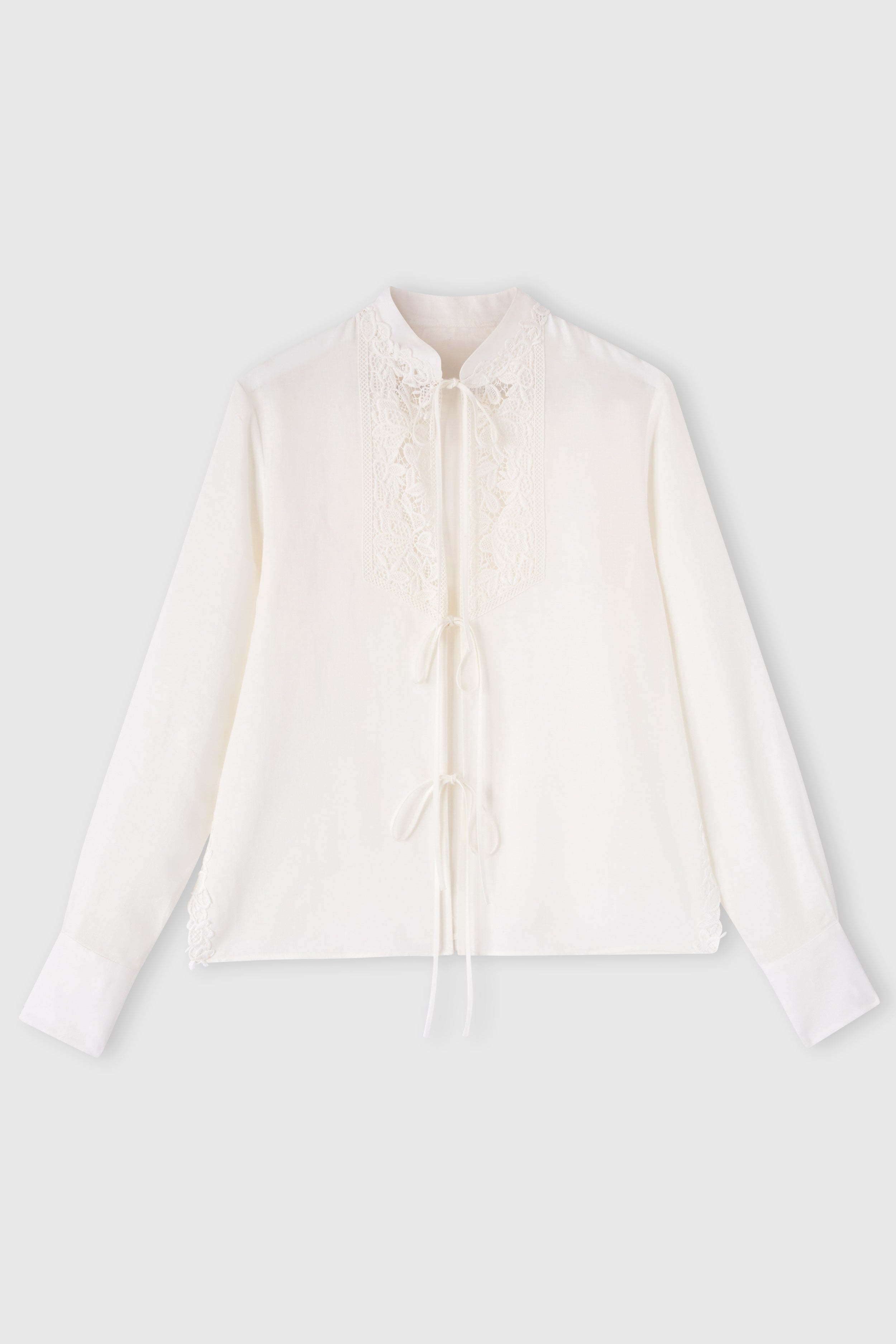 Linen blouse with ties and floral rebrodé lace