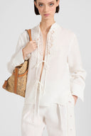 Linen blouse with ties and floral rebrodé lace