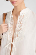 Linen blouse with ties and floral rebrodé lace