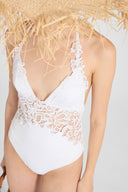 One-piece swimsuit with V-neck and macramé lace inserts