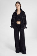 Pantalone palazzo in pizzo con cristalli applicati a mano