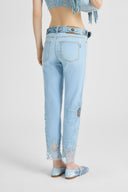 Straight-leg denim trousers with hand-applied rebrodè lace