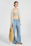 Baggy trousers in jacquard check denim with printed silk scarf belt