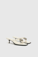 Nappa thong sandal with 5 cm heel and metal daisy