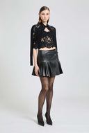 Pleated faux leather-effect mini skirt with double side belt
