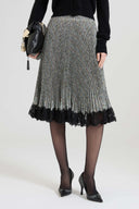 Below-the-knee pleated skirt in cady with resca print and contrasting lace hem