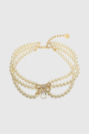 Collana choker di perle con fiocco scultoreo e cristallo