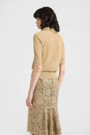 Polo in cotone e lurex con colletto in tulle ricamato