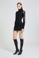 Long-sleeved virgin wool turtleneck sweater with lace and crystals