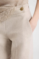 Wide-leg tailored trousers with heraldic buttons