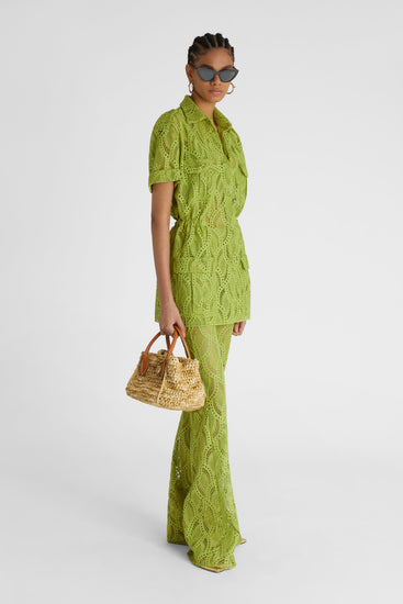 Model in green flared macramé palazzo trousers with small concealed side zip