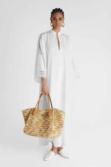 Model showcasing pure linen White Kaftan with cap sleeves and embroidery