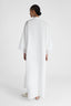 Model's back showcasing pure linen White Kaftan with cap sleeves and embroidery