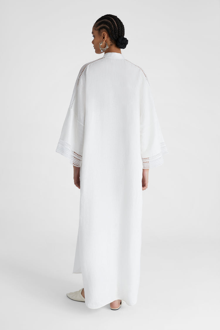 Model's back showcasing pure linen White Kaftan with cap sleeves and embroidery
