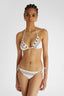 Model showcasing White Two-Piece Triangle Bikini with ties adorned with colourful embroidery