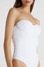 Close up of model in white one-piece swimsuit with removable straps and irregular handmade drapes
